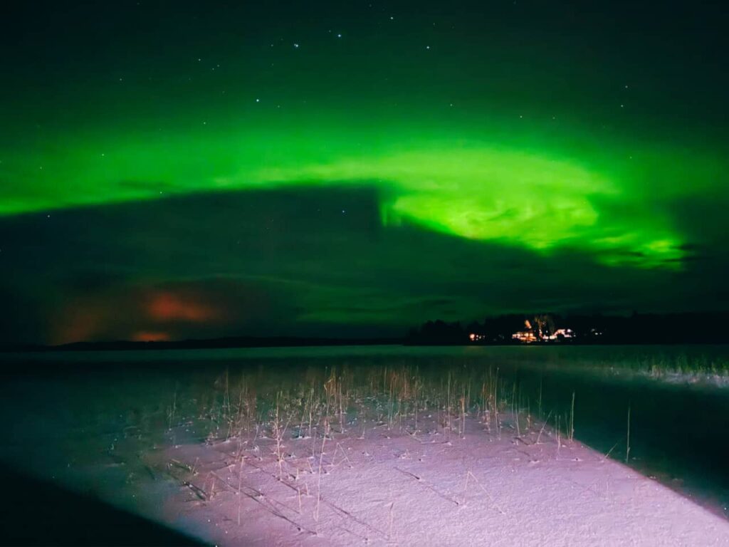 Aurora Borealis on the frozen lake