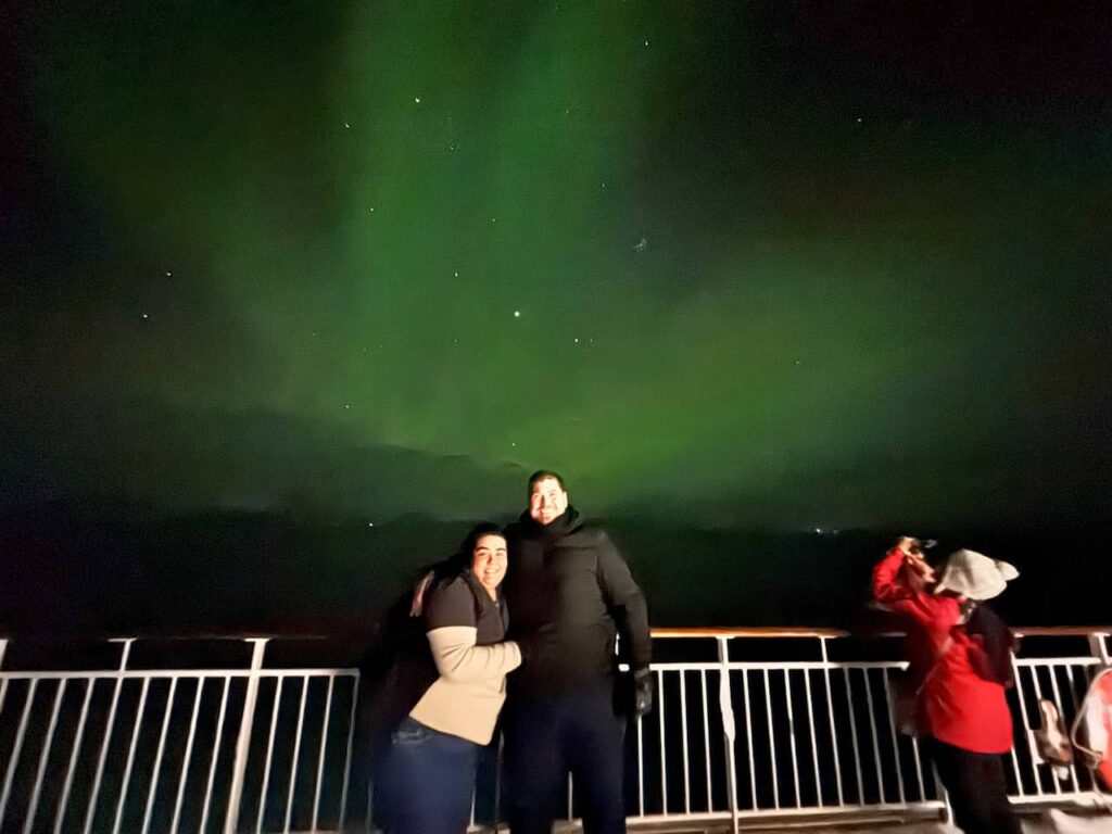 Paola, André and the northern lights from the deck of the ship