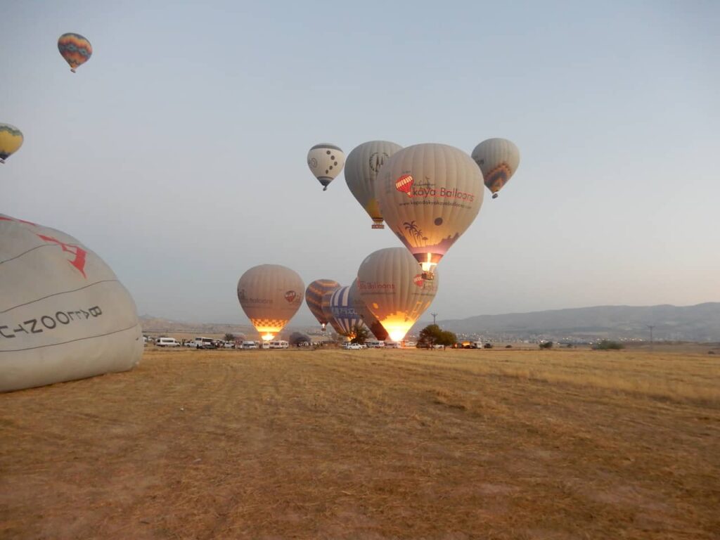 Hot air balloon rising in Cappadocia