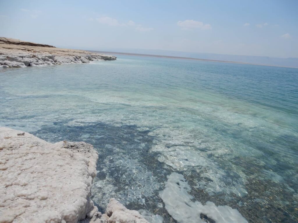 Beach on the Dead Sea with salt formation.