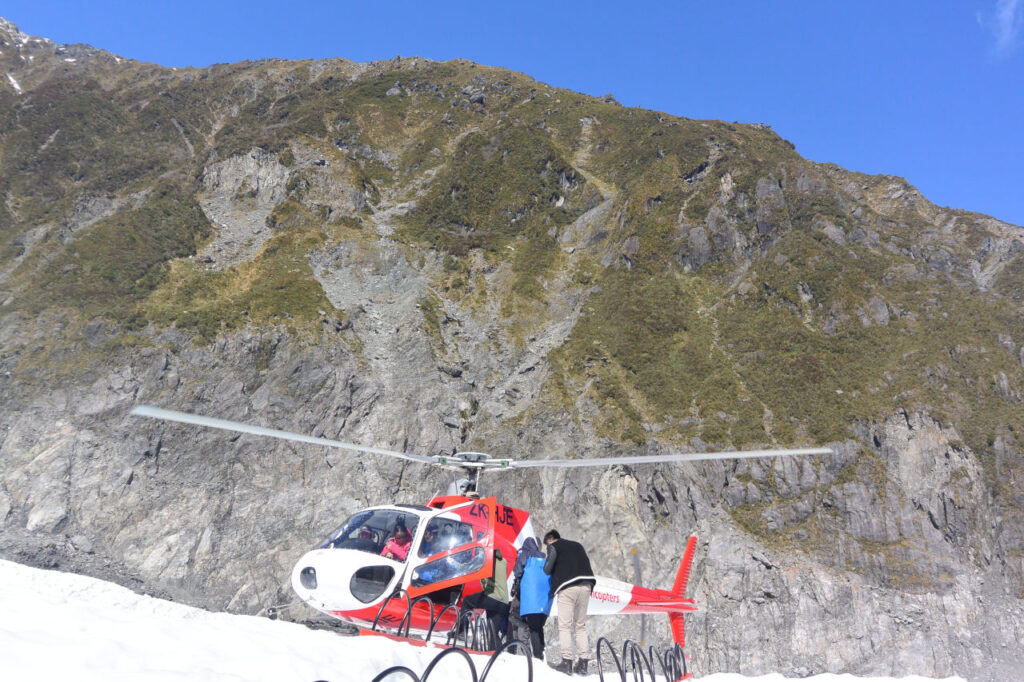 Helicopter landing on Fox Glacier