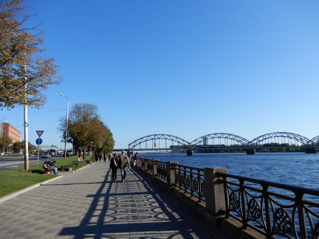 Walk along the Daugava River with the railway bridge